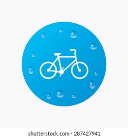 Water drops on button. Bicycle sign icon. Eco delivery. Family vehicle symbol. Realistic pure raindrops. Blue circle. Vector