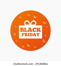 Water drops on button. Black friday gift sign icon. Sale symbol. Special offer label. Realistic pure raindrops. Orange circle. Vector