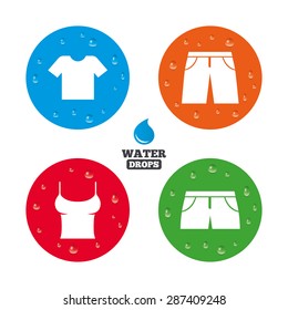 Water drops on button. Clothes icons. T-shirt and pants with shorts signs. Swimming trunks symbol. Realistic pure raindrops on circles. Vector