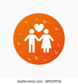 Water drops on button. Couple sign icon. Male love female. Lovers with heart. Realistic pure raindrops. Orange circle. Vector