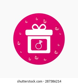 Water drops on button. Gift box sign icon. Present with engagement ring symbol. Realistic pure raindrops. Pink circle. Vector