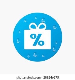 Water drops on button. Gift box sign discount icon. Present symbol. Realistic pure raindrops. Blue circle. Vector