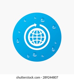 Water drops on button. Globe sign icon. Round the world arrow symbol. Full rotation. Realistic pure raindrops. Blue circle. Vector