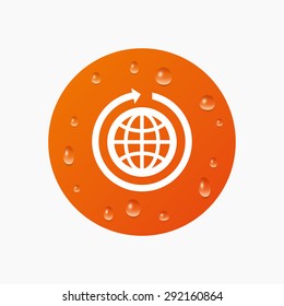 Water drops on button. Globe sign icon. Round the world arrow symbol. Full rotation. Realistic pure raindrops. Orange circle. Vector