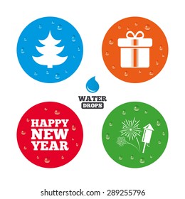 Water drops on button. Happy new year icon. Christmas tree and gift box signs. Fireworks rocket symbol. Realistic pure raindrops on circles. Vector