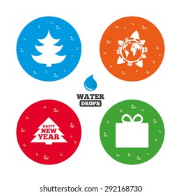 Water drops on button. Happy new year icon. Christmas trees and gift box signs. World globe symbol. Realistic pure raindrops on circles. Vector