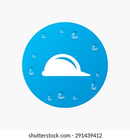 Water drops on button. Hard hat sign icon. Construction helmet symbol. Realistic pure raindrops. Blue circle. Vector