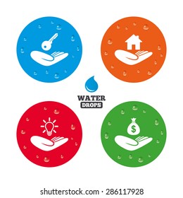 Water drops on button. Helping hands icons. Financial money savings insurance symbol. Home house or real estate and lamp, key signs. Realistic pure raindrops on circles. Vector