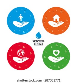 Water drops on button. Helping hands icons. Heart health and travel trip insurance symbols. Home house or real estate sign. Realistic pure raindrops on circles. Vector
