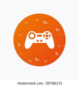 Water drops on button. Joystick sign icon. Video game symbol. Realistic pure raindrops. Orange circle. Vector