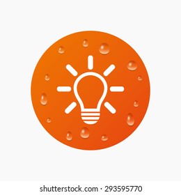 Water drops on button. Light lamp sign icon. Idea symbol. Light is on. Realistic pure raindrops. Orange circle. Vector