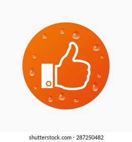 Water drops on button. Like sign icon. Thumb up sign. Hand finger up symbol. Realistic pure raindrops. Orange circle. Vector