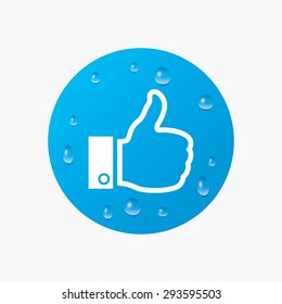 Water drops on button. Like sign icon. Thumb up sign. Hand finger up symbol. Realistic pure raindrops. Blue circle. Vector