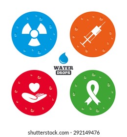 Water drops on button. Medicine icons. Syringe, life insurance, radiation and ribbon signs. Breast cancer awareness symbol. Hand holds heart. Realistic pure raindrops on circles. Vector