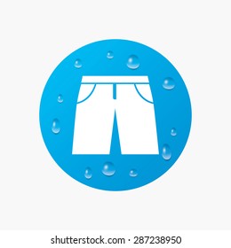 Water drops on button. Men's Bermuda shorts sign icon. Clothing symbol. Realistic pure raindrops. Blue circle. Vector