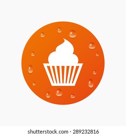 Water drops on button. Muffin sign icon. Cupcake symbol. Realistic pure raindrops. Orange circle. Vector