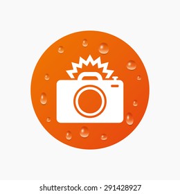 Water drops on button. Photo camera sign icon. Photo flash symbol. Realistic pure raindrops. Orange circle. Vector