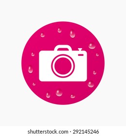 Water drops on button. Photo camera sign icon. Digital photo camera symbol. Realistic pure raindrops. Pink circle. Vector