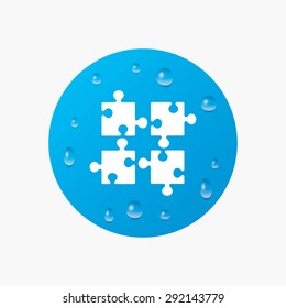Water drops on button. Puzzles pieces sign icon. Strategy symbol. Ingenuity test game. Realistic pure raindrops. Blue circle. Vector