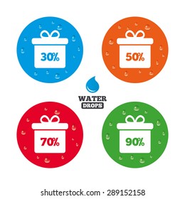 Water drops on button. Sale gift box tag icons. Discount special offer symbols. 30%, 50%, 70% and 90% percent discount signs. Realistic pure raindrops on circles. Vector