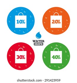Water drops on button. Sale bag tag icons. Discount special offer symbols. 10%, 20%, 30% and 40% percent discount signs. Realistic pure raindrops on circles. Vector