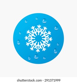 Water drops on button. Snowflake artistic sign icon. Christmas and New year winter symbol. Air conditioning symbol. Realistic pure raindrops. Blue circle. Vector