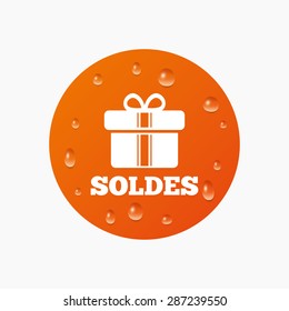 Water drops on button. Soldes - Sale in French sign icon. Gift box with ribbons symbol. Realistic pure raindrops. Orange circle. Vector