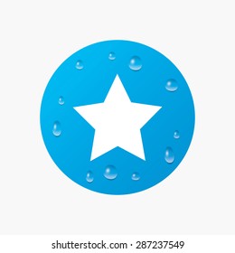 Water drops on button. Star sign icon. Favorite button. Navigation symbol. Realistic pure raindrops. Blue circle. Vector