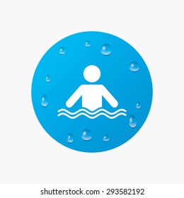 Water drops on button. Swimming sign icon. Pool swim symbol. Sea wave. Realistic pure raindrops. Blue circle. Vector
