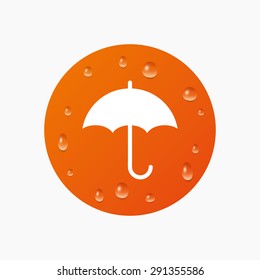Water drops on button. Umbrella sign icon. Rain protection symbol. Realistic pure raindrops. Orange circle. Vector