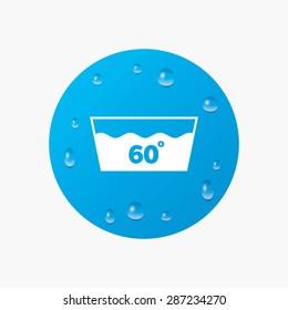 Water drops on button. Wash icon. Machine washable at 60 degrees symbol. Realistic pure raindrops. Blue circle. Vector