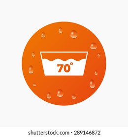 Water drops on button. Wash icon. Machine washable at 70 degrees symbol. Realistic pure raindrops. Orange circle. Vector