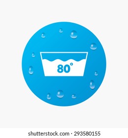 Water drops on button. Wash icon. Machine washable at 80 degrees symbol. Realistic pure raindrops. Blue circle. Vector