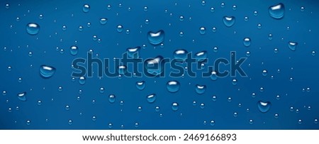 Water drops, realistic droplets of liquid on a blue background.