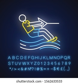 Water skiing neon light icon. Surface watersport. Summer leisure and dangerous hobby. Man wakeboarding.Glowing sign with alphabet, numbers and symbols. Vector isolated illustration