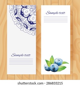 Watercolor blueberries. Vector, isolated. Illustration for cooking site, menus, books.
Card on wooden texture.