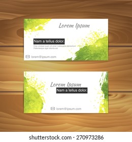 watercolor business cards on wood desk