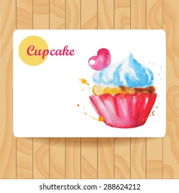 Watercolor cupcake with cream and candy. Cupcake in Burgundy confectionery paper form. Vector illustration.  Illustration for cooking site, menus, books. Card on wooden texture.
