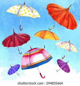 watercolor illustration of colorful umbrellas against the sky