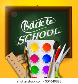 Watercolor paint, crayons, scissors,  ruler and protractor, on the yellow background with the school board "back to school" text.  Bright concept advertising banner or flyer to the school subject