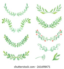 Watercolor painted laurels set. Floral wreaths and plants.