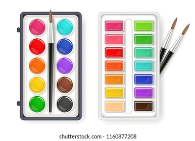 Watercolor palette drawing set with brushes isolated on white. Aquarelle different type of colors