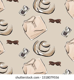 watercolor pattern sunglasses, vantage camera, hat and folded blazer