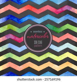 Watercolor red, yellow, green, blue, purple striped seamless background on the blackboard 