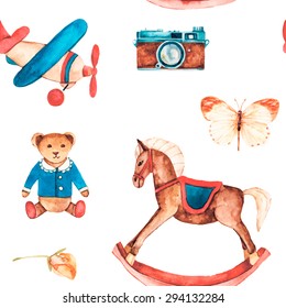 Watercolor vintage seamless pattern. Hand drawn toys and elements: rocking horse, teddy bear, model plane, camera, butterfly. Retro vector baby objects for your design.