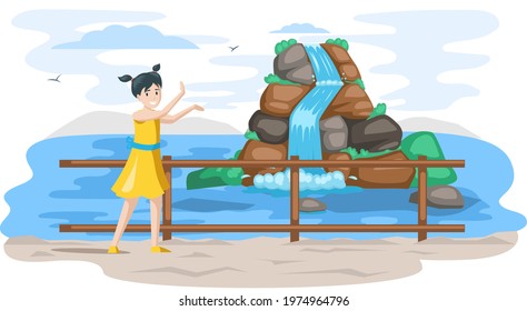 Waterfall in mountaines natural landscape in park on Jeju island. Water flow falls down mountain. Little girl stands next to tourist attraction of asian island in south korea, place of visit
