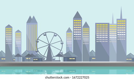 Waterfront city or town near the river And a large Ferris wheel With the reflection on the water surface.