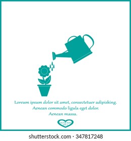 Watering can with flower