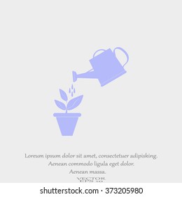 Watering can with flower