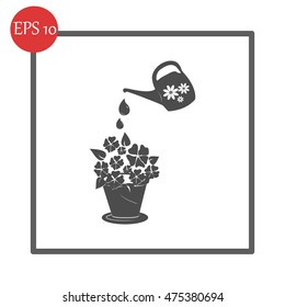watering can with flower